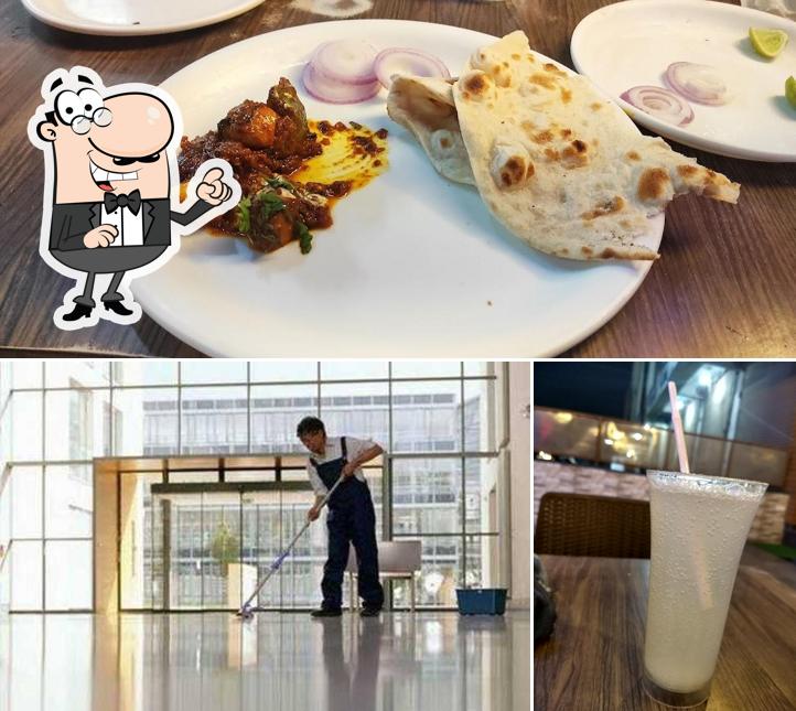 Take a look at the image showing interior and beverage at Bansuri Restaurant & Bar By County Hotels