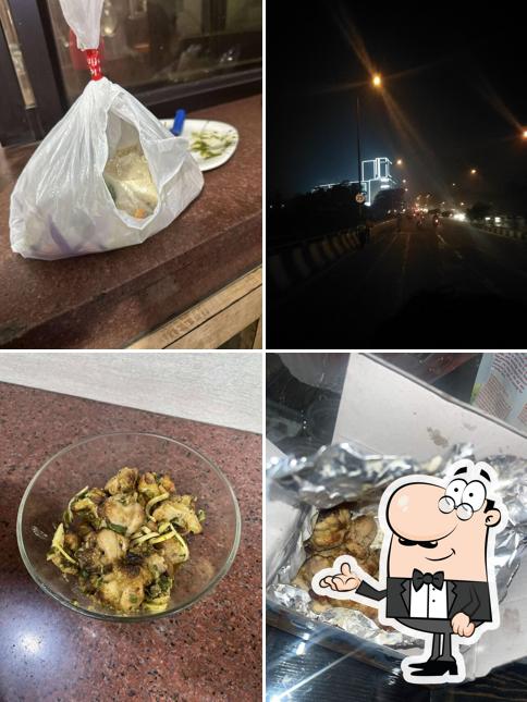 Take a seat at one of the tables at Aman Chicken Dhaba