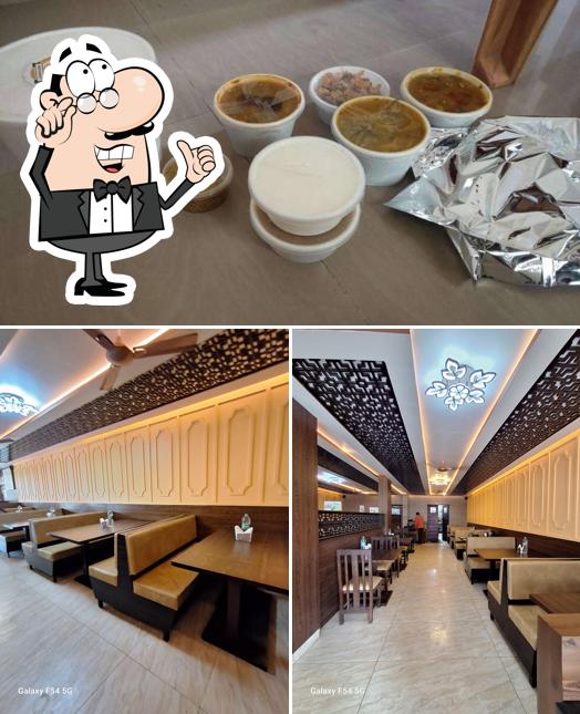 Take a seat at one of the tables at Advaita Restaurant - Whitefield