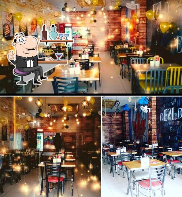 Take a seat at one of the tables at Basra cafe & Restaurant