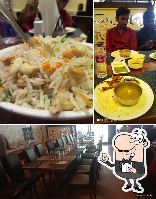 Take a seat at one of the tables at Sarigama Family Restaurant