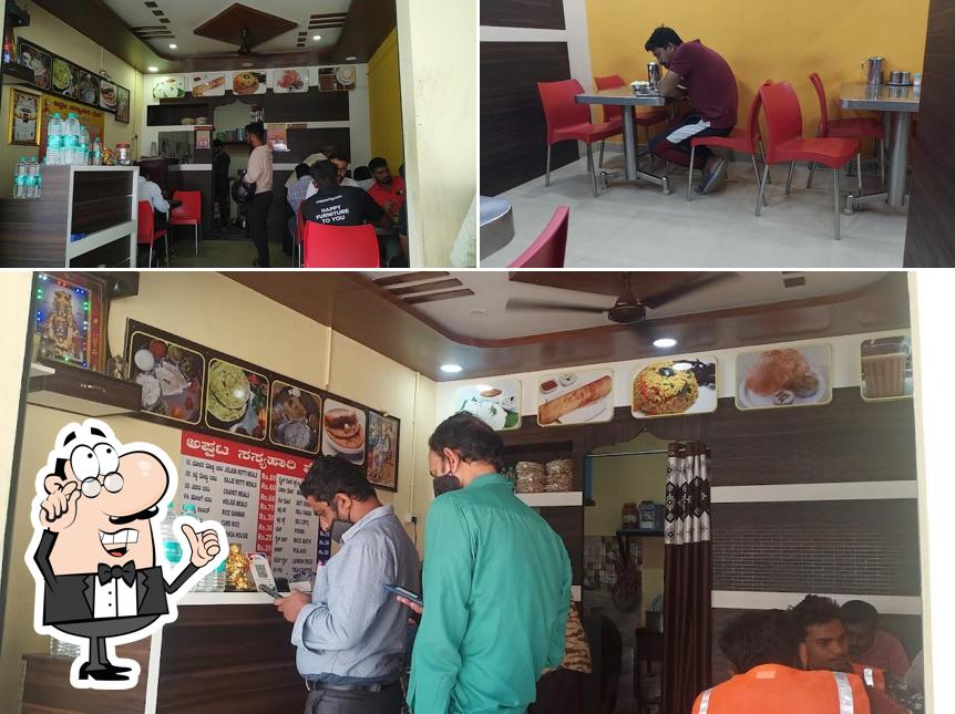 Take a seat at one of the tables at Basaveshwar khanavali & Tiffin center