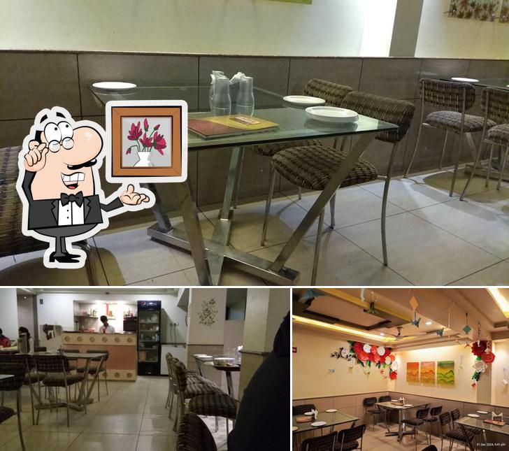 Take a seat at one of the tables at Ruchida Restaurant