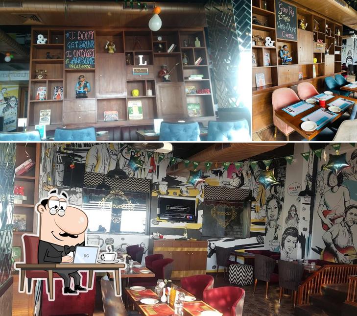 Take a seat at one of the tables at Labooze Cafe Bar Lounge Mcleodganj