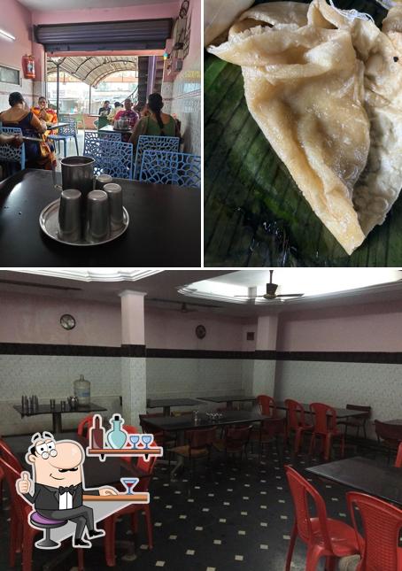 The photo of interior and food at Saravana Coffee & Tiffins