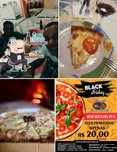 Sente em uma das mesas no Pizzaria Forno Quente