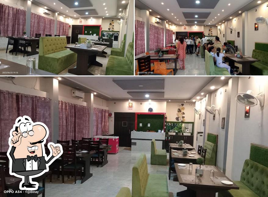 Take a seat at one of the tables at GREEN GARDEN FAMILY RESTAURANT