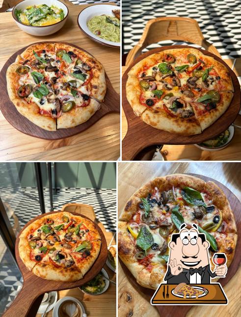 Get pizza at Fauna Cafe
