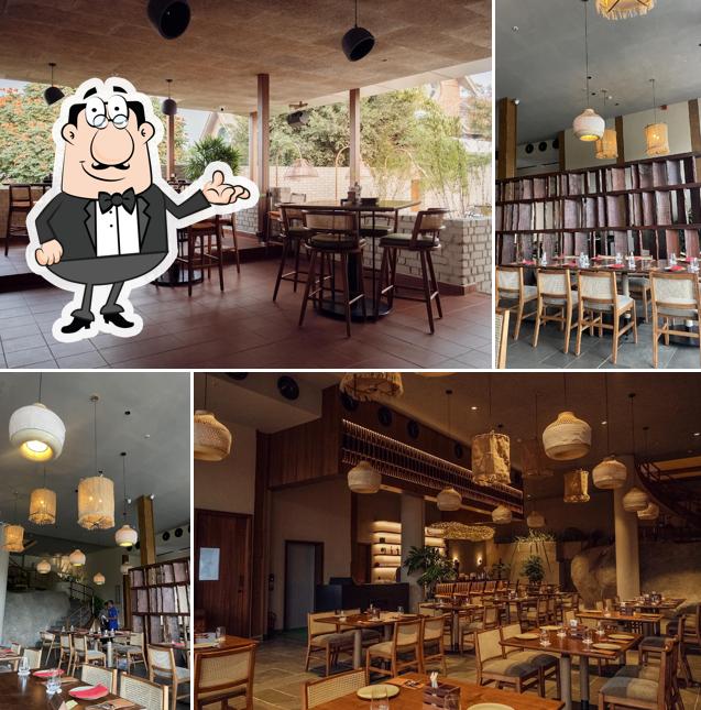 Take a seat at one of the tables at Rü - Craft Bar • Art Cuisine