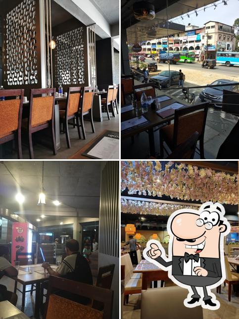 Take a seat at one of the tables at The Calicut Kitchen