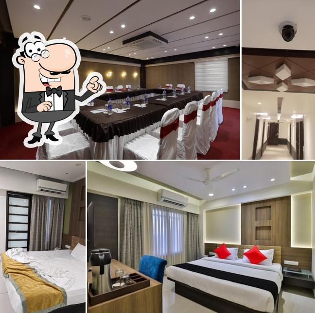 Take a seat at one of the tables at Hotel The Lotus Park Ellisbridge, Paldi, Ahmedabad