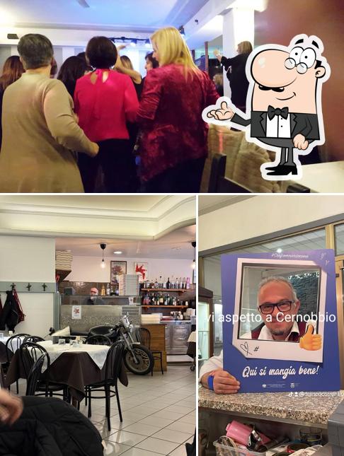 Siediti a un tavolo di La Nuova Pergola Ristorante Pizzeria Italiana