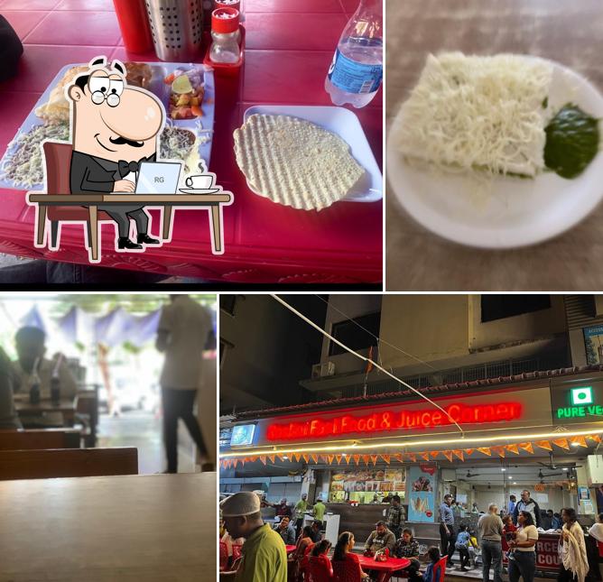 Take a seat at one of the tables at Roshni Fast Food & Juice Corner