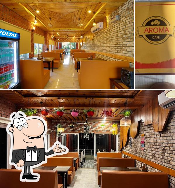 Take a look at the picture displaying interior and beer at aroma cafe