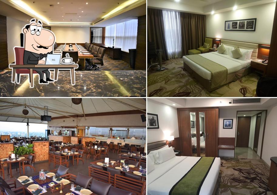 Take a seat at one of the tables at Sayaji Hotel