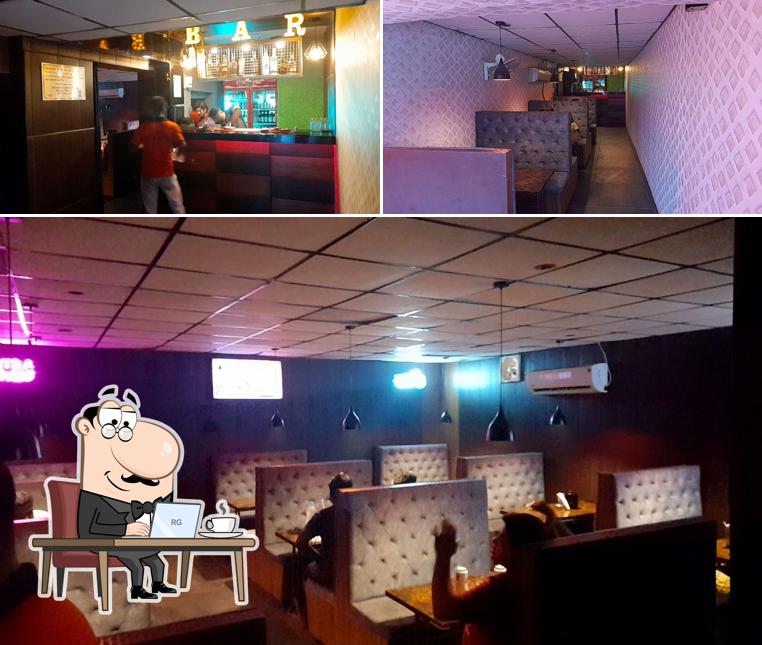 Take a seat at one of the tables at Sip N Dip Bar & Restaurant