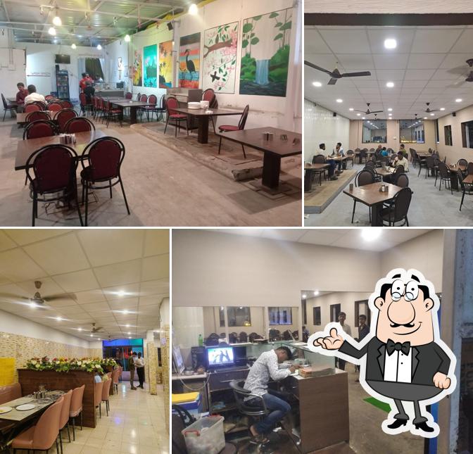 Take a seat at one of the tables at Jain Bhoj