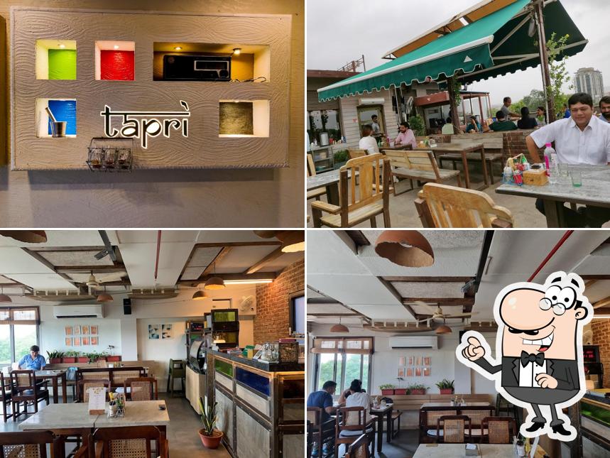 Take a seat at one of the tables at Tapri Central