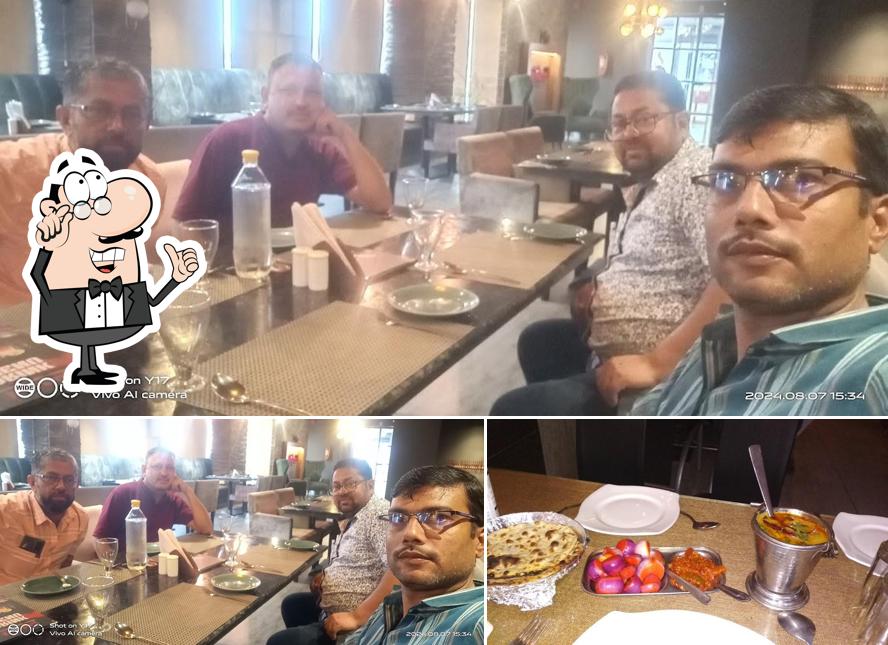 Check out the image showing interior and food at Kwality Restaurant & Bar