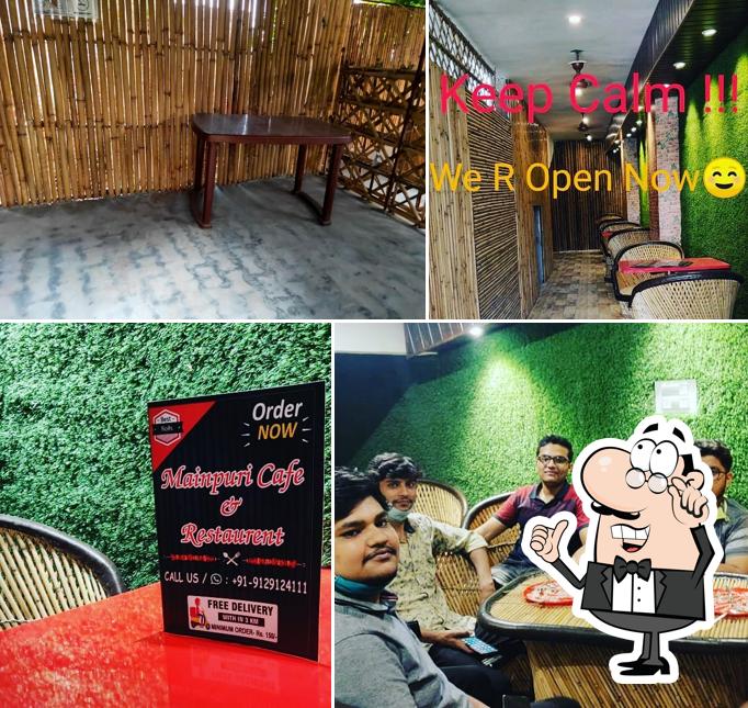 Take a seat at one of the tables at Mainpuri Cafe & Restaurant