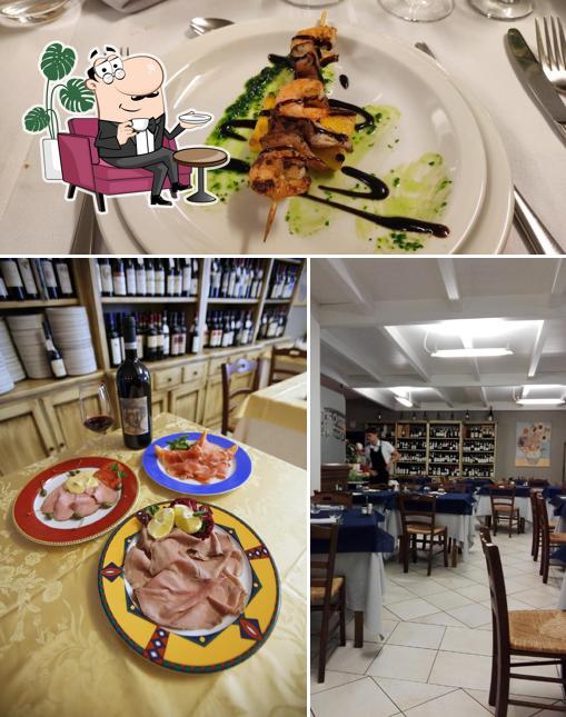 Dai un’occhiata alla foto che mostra la interni e cibo di Tre Amis