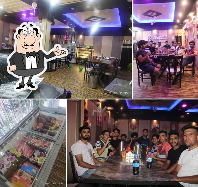Take a seat at one of the tables at City Cafe Rehan