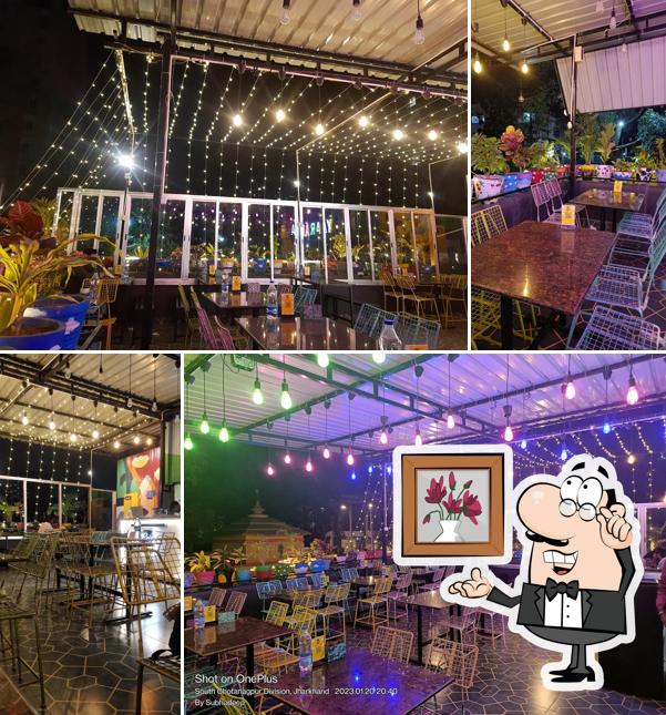 Take a seat at one of the tables at Cafe BAE Ranchi