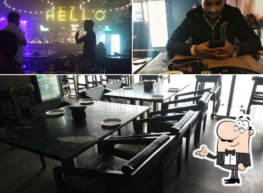 Take a seat at one of the tables at Twist Bar & Lounge