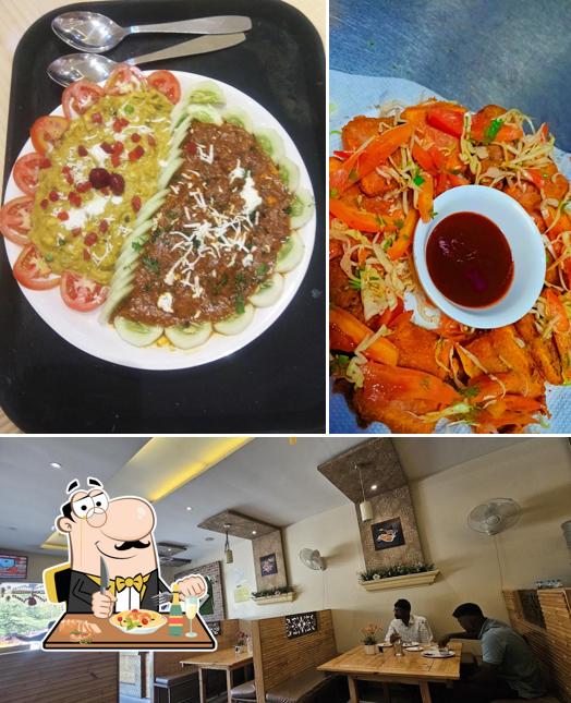 Take a look at the photo depicting food and interior at Hotel Vishwajit