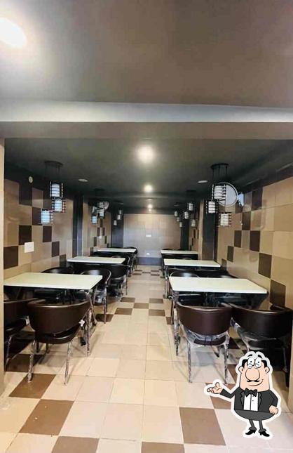 Take a seat at one of the tables at Chai Sutta Bar kalka