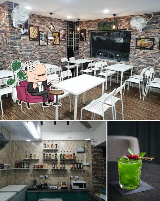 The photo of interior and beverage at Revival Cafe
