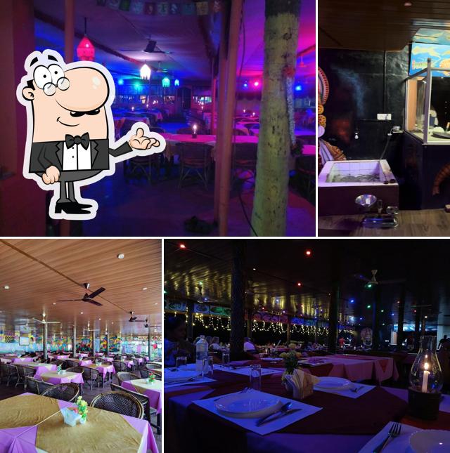 Take a seat at one of the tables at Coconut Grove