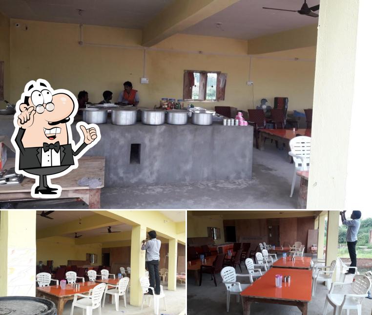 Take a seat at one of the tables at Vandan Dhaba and Family Restaurant