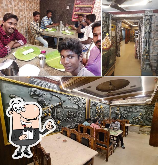 Take a seat at one of the tables at Hotel Deva amirtham