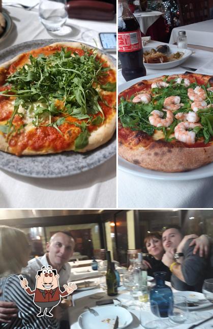 Guarda la foto che mostra la cibo e tavolo da pranzo di Ristorante Capriccio. Pizzeria