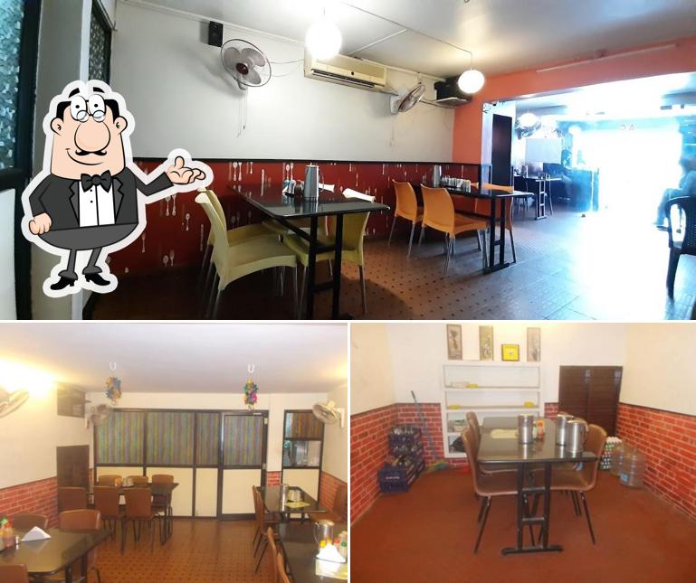 Take a seat at one of the tables at Hot Spice Kitchen
