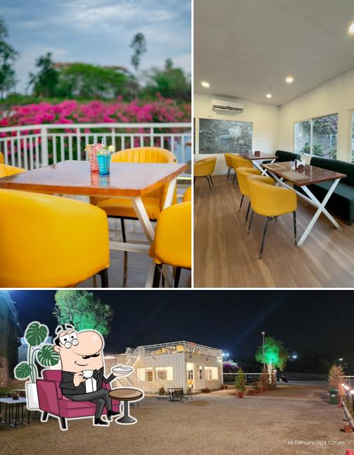 Take a seat at one of the tables at Aurosky Udaipur - Adventure Dine-in Restaurant