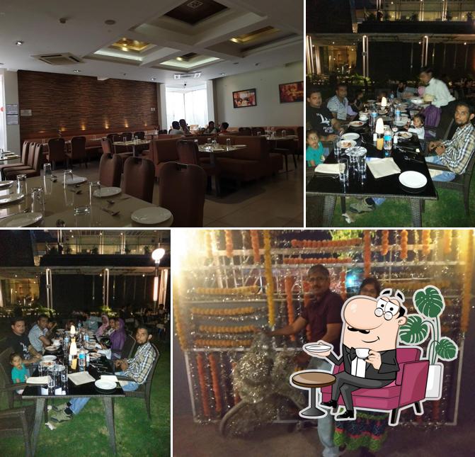 Take a seat at one of the tables at Madhuban Exclusive Garden Restaurant-AURANGABAD