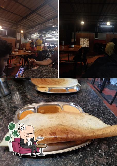 Check out the picture showing interior and food at നീലാംബരി
