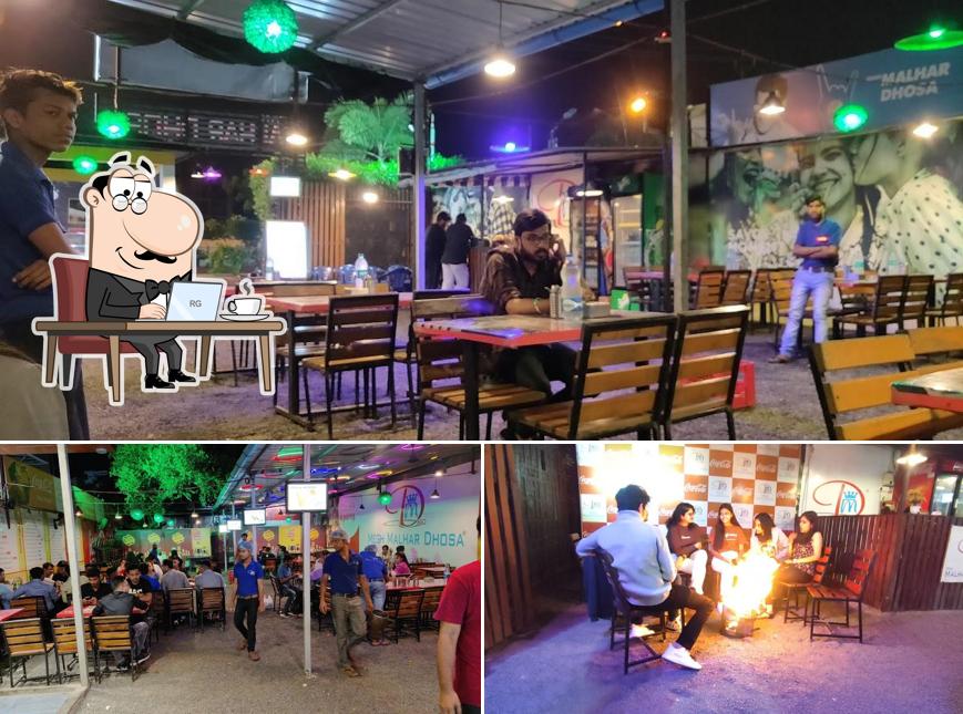 Take a seat at one of the tables at Megh Malhar Dhosa
