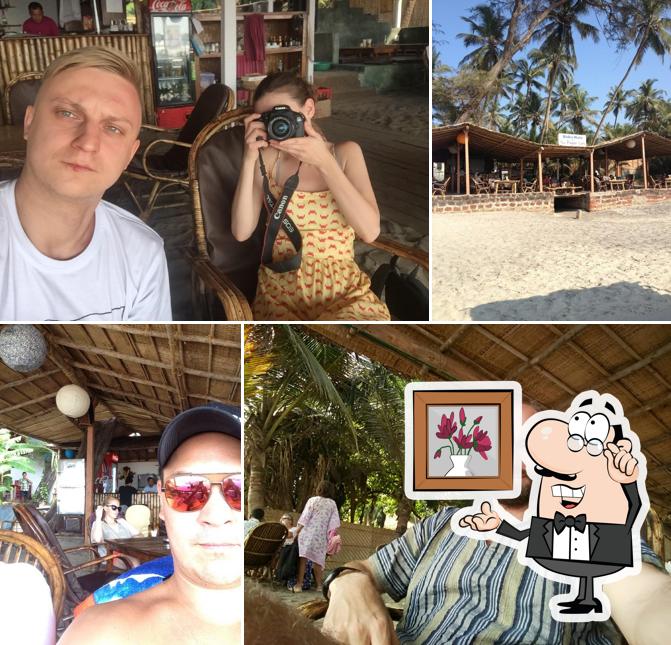 Take a seat at one of the tables at Babu Huts with Pagan Cafe