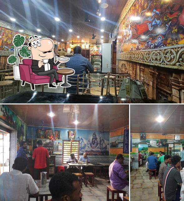 Take a seat at one of the tables at Kailasam Vegeterian Cafe