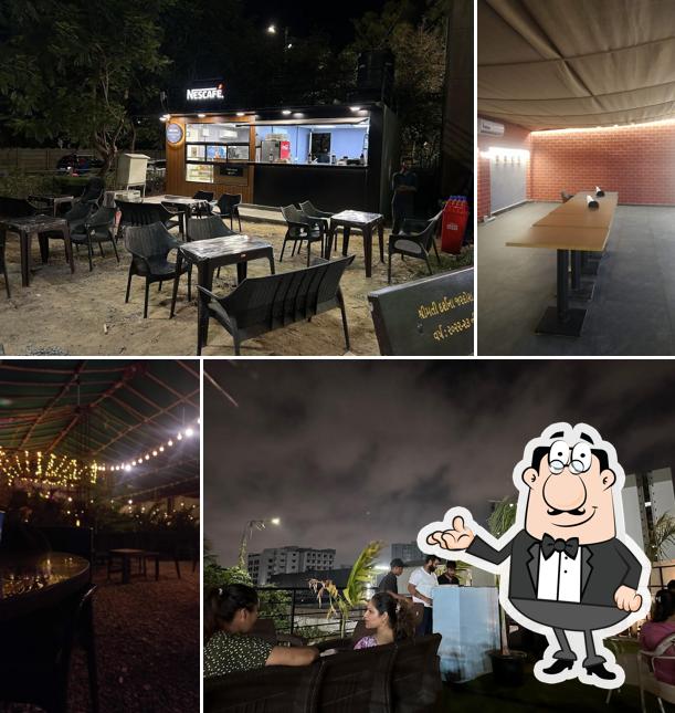 Take a seat at one of the tables at Nescafe