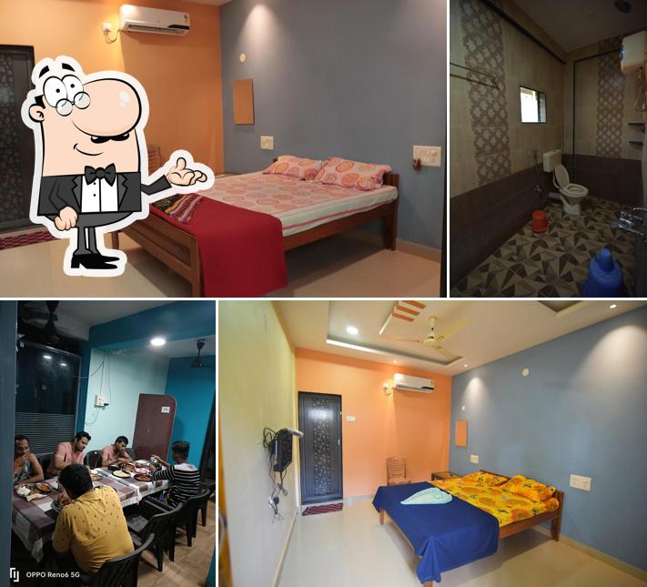 Take a seat at one of the tables at Kaka Home Stay Tarkarli Beach Malvan