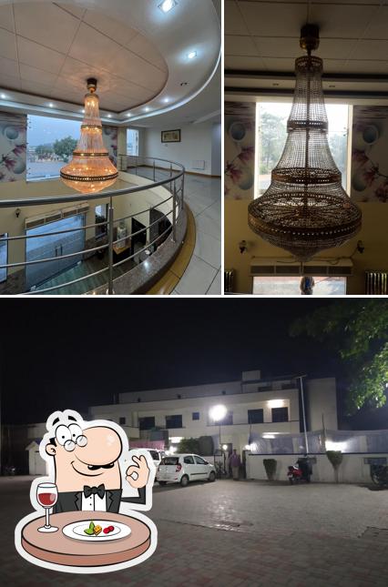 Check out the picture showing food and exterior at Hotel Vasu International