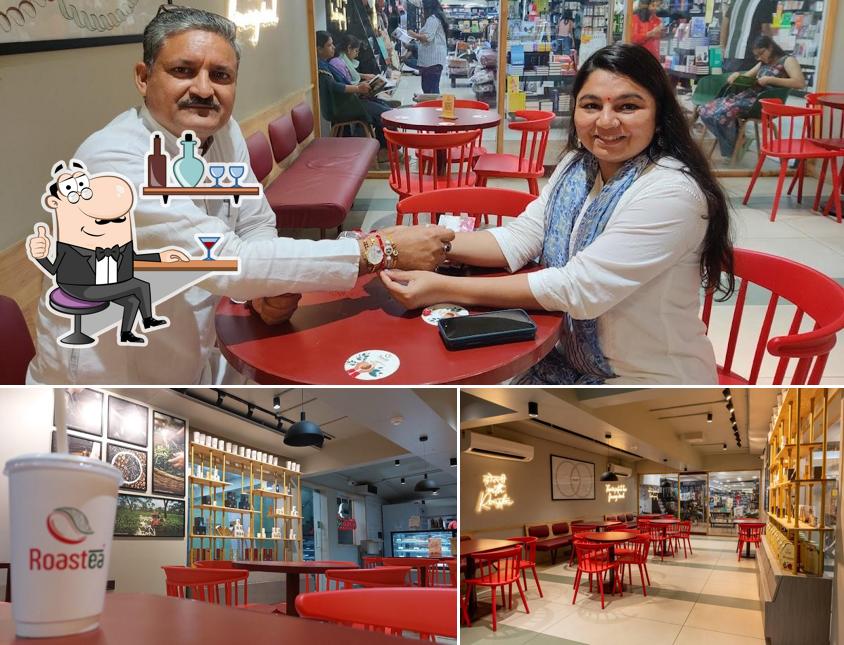 Take a seat at one of the tables at Roastea - Curated Coffee And Tea Artisans