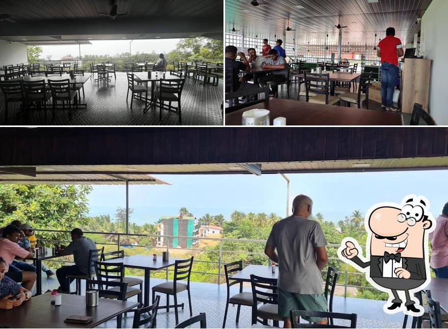 Take a seat at one of the tables at Udupi Anand Sagar Veg