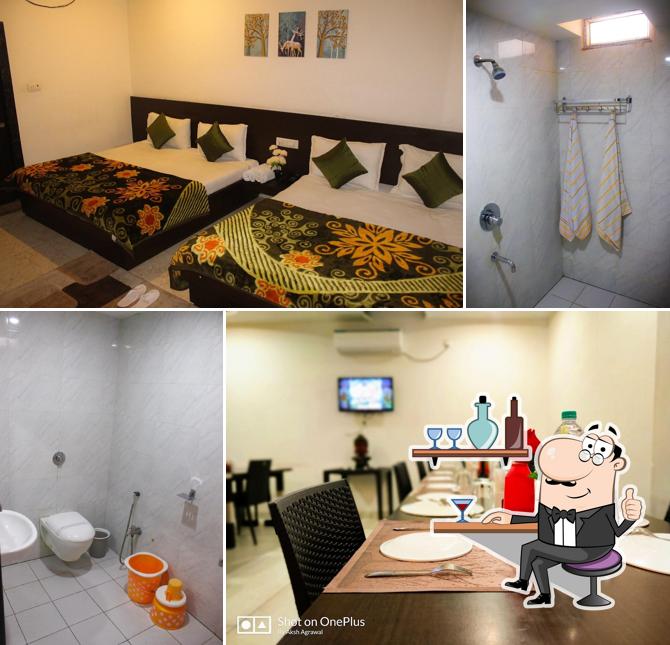 Take a seat at one of the tables at The Kasturi Hotel & Restaurant