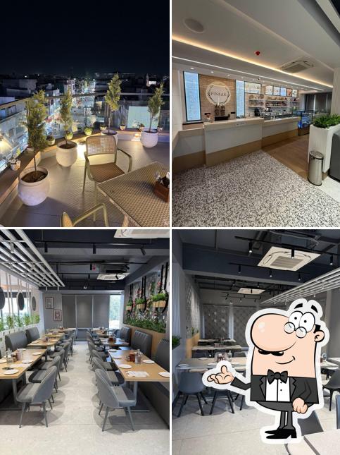 Take a seat at one of the tables at Pinaaki Cafe & Restaurant