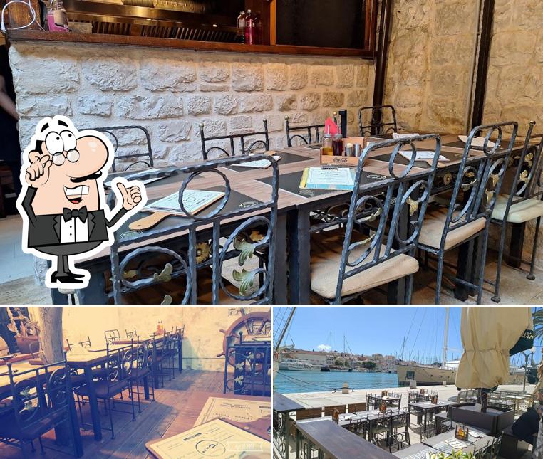 Siediti a un tavolo di Restoran Capo